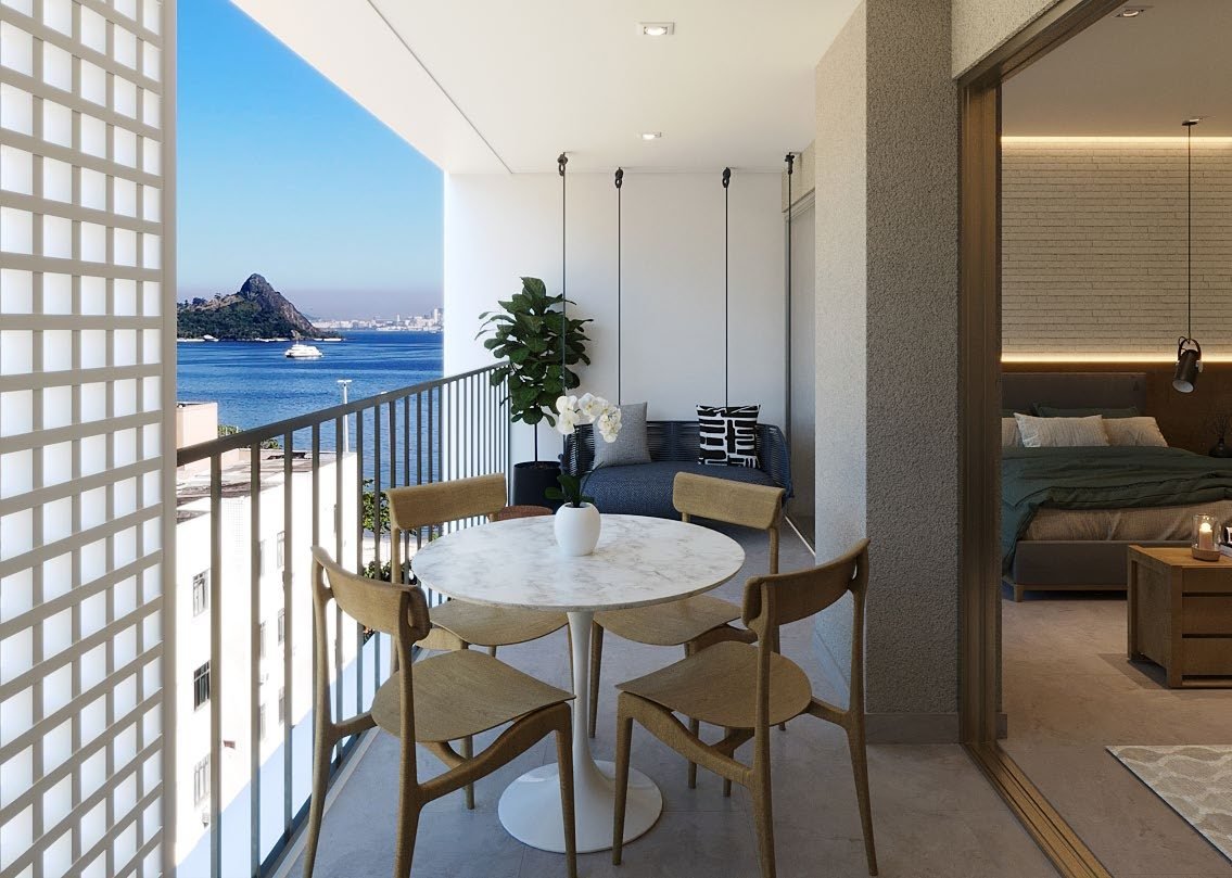 Perspectiva da varanda gourmet de um studio do Sou+ Charitas, com vista para a baía